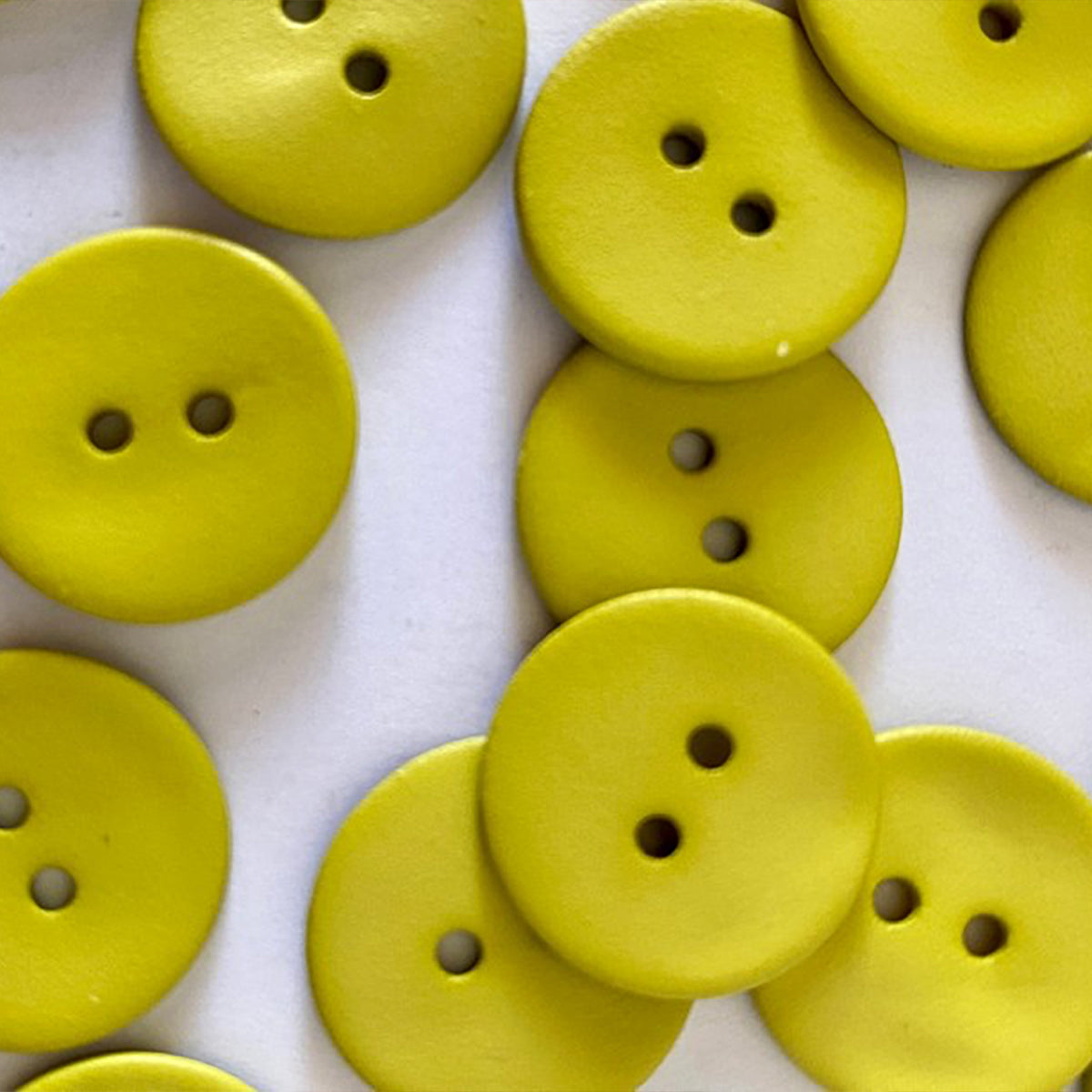 Matt shell opaque bright yellow colour button
